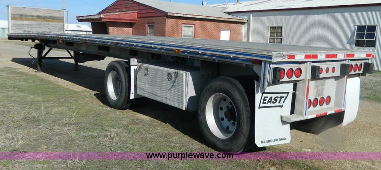 image for item G7829 1990 East aluminum flatbed trailer