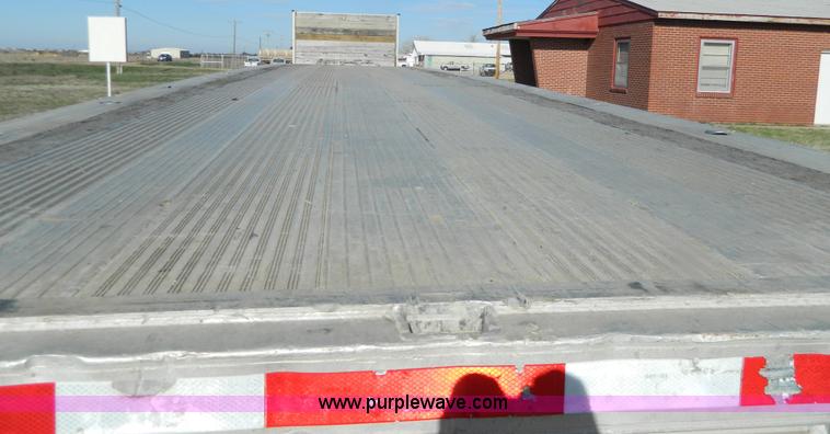 image for item G7829 1990 East aluminum flatbed trailer