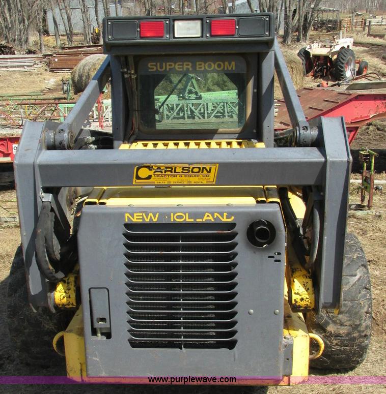 image for item E5062 New Holland LS180 skid steer