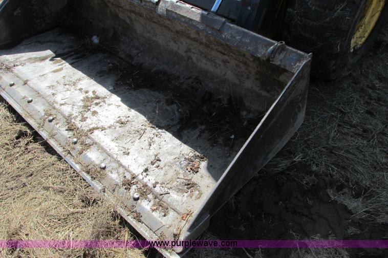 image for item E5062 New Holland LS180 skid steer