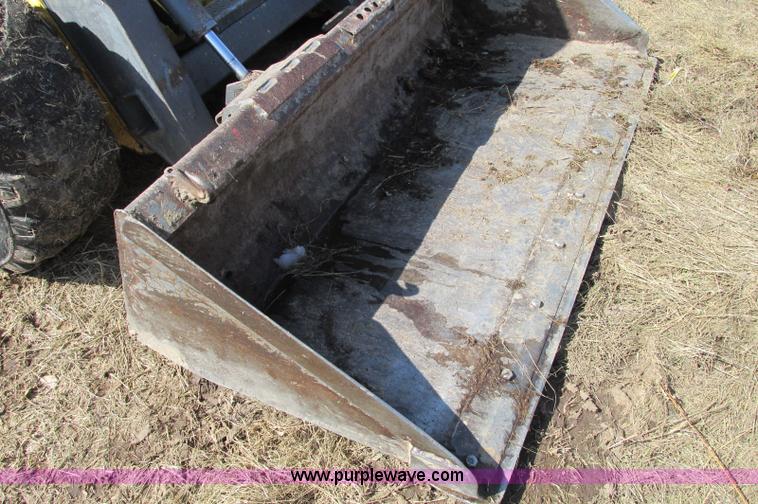 image for item E5062 New Holland LS180 skid steer