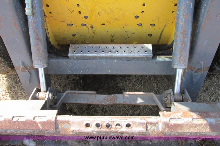 image for item E5062 New Holland LS180 skid steer