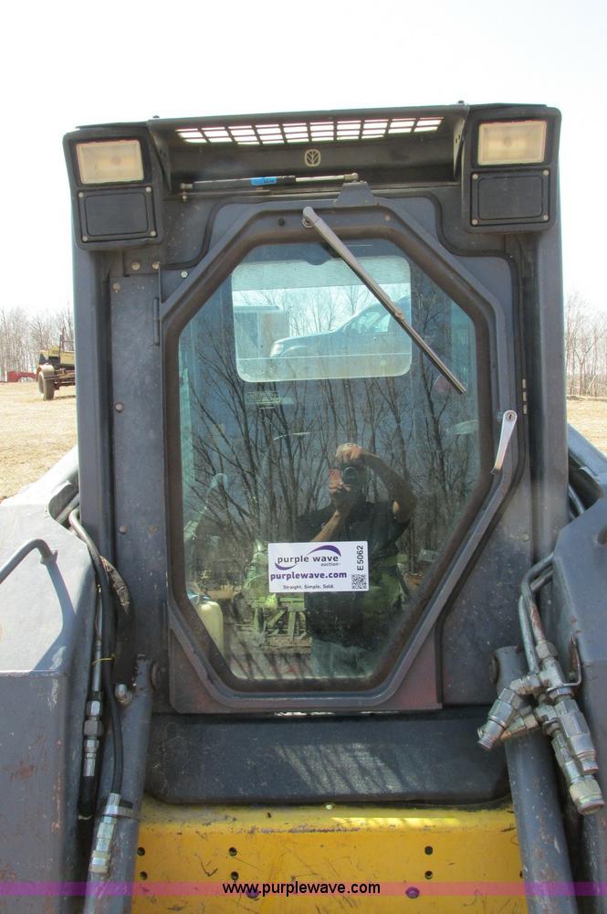 image for item E5062 New Holland LS180 skid steer