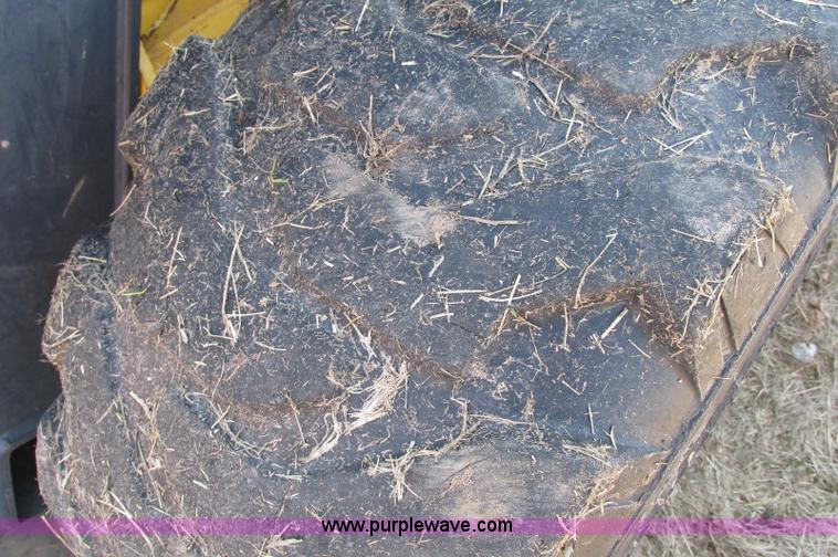 image for item E5062 New Holland LS180 skid steer