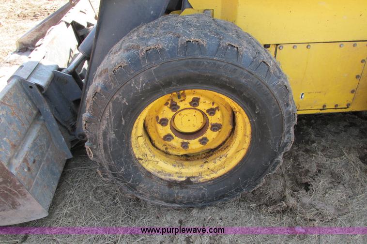 image for item E5062 New Holland LS180 skid steer