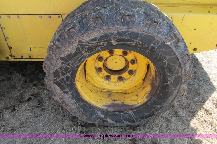 image for item E5062 New Holland LS180 skid steer