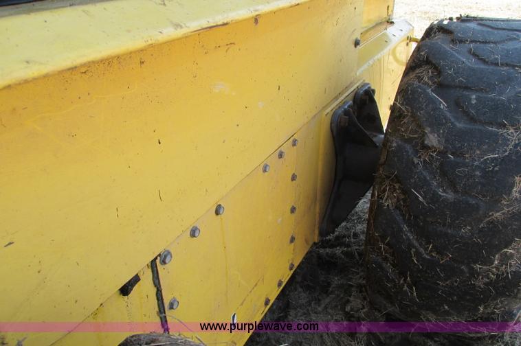 image for item E5062 New Holland LS180 skid steer