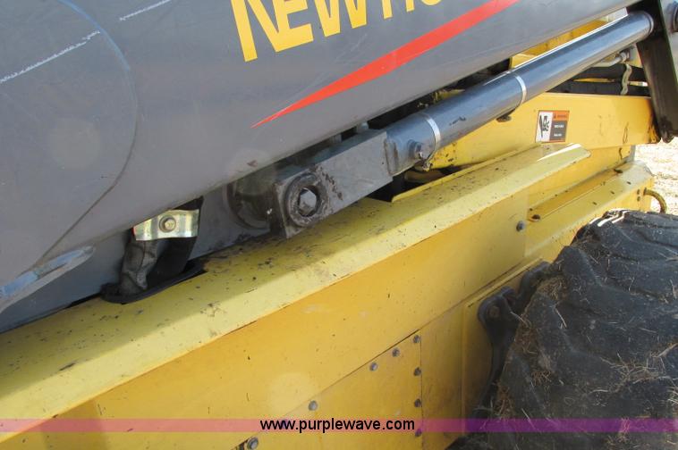 image for item E5062 New Holland LS180 skid steer
