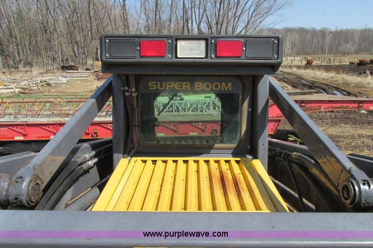 image for item E5062 New Holland LS180 skid steer