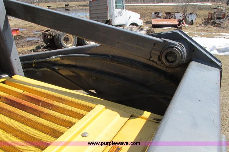 image for item E5062 New Holland LS180 skid steer