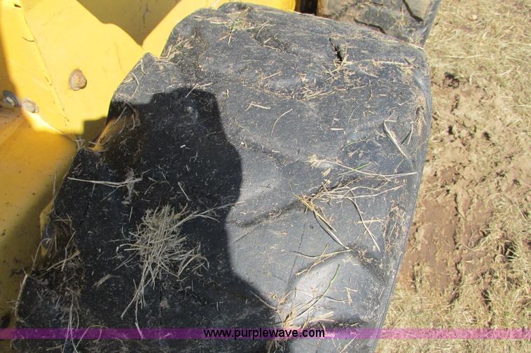 image for item E5062 New Holland LS180 skid steer