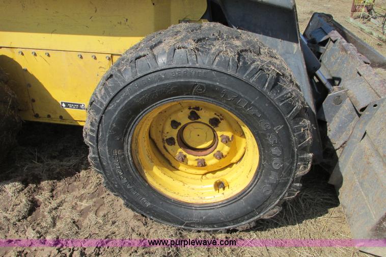 image for item E5062 New Holland LS180 skid steer