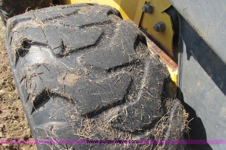 image for item E5062 New Holland LS180 skid steer