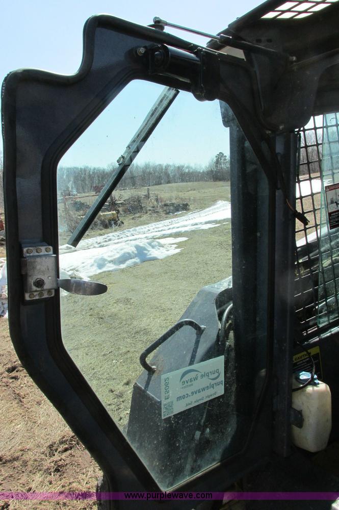 image for item E5062 New Holland LS180 skid steer