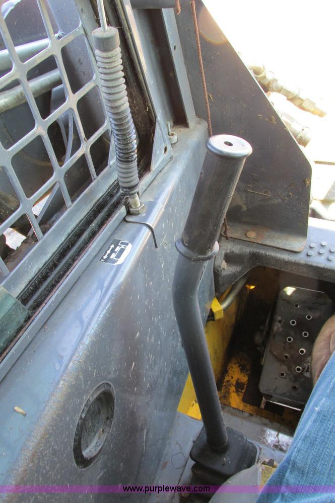 image for item E5062 New Holland LS180 skid steer