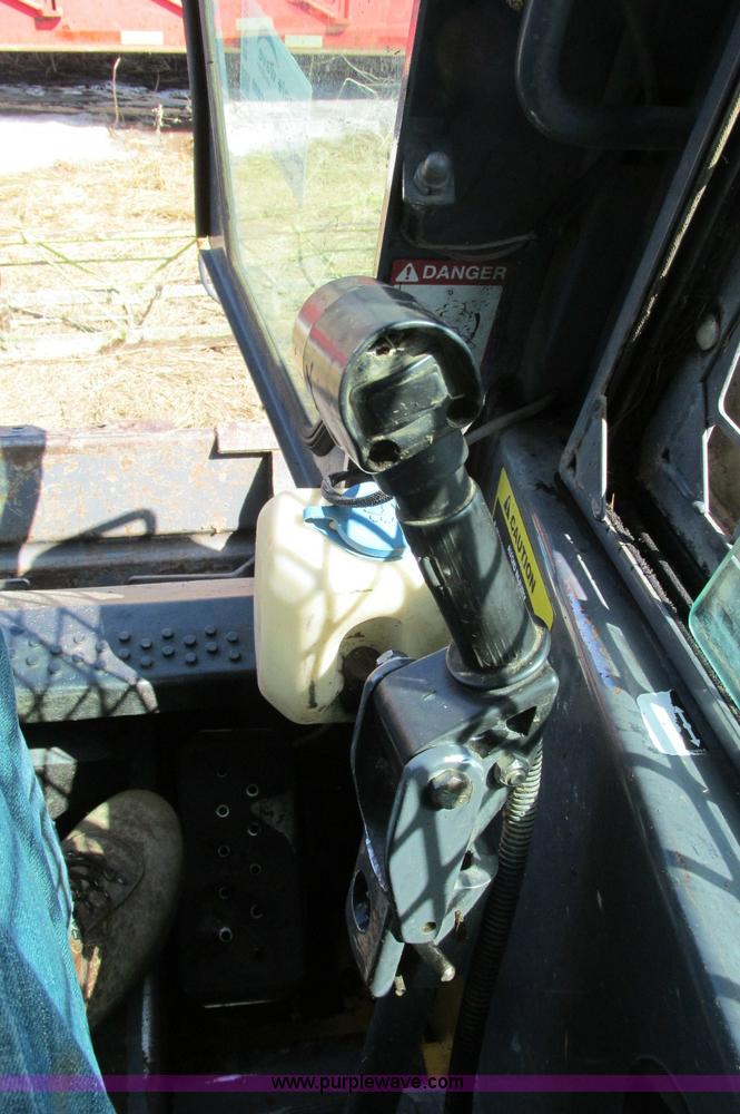 image for item E5062 New Holland LS180 skid steer