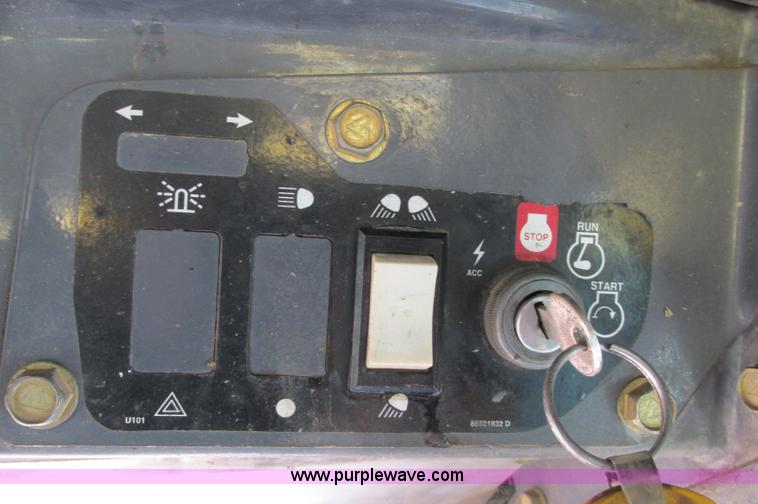 image for item E5062 New Holland LS180 skid steer