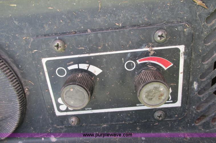 image for item E5062 New Holland LS180 skid steer