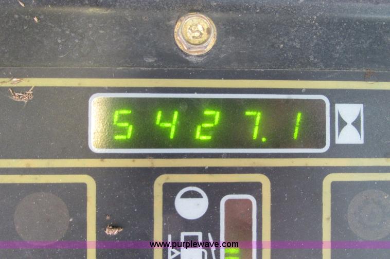 image for item E5062 New Holland LS180 skid steer