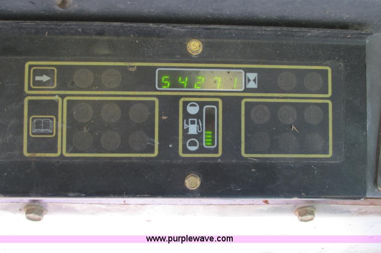 image for item E5062 New Holland LS180 skid steer