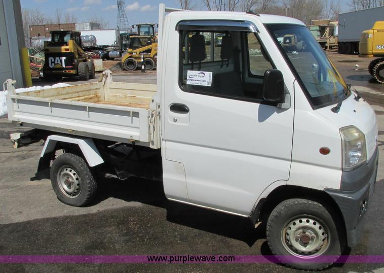 image for item E5072 1999 Mitsubishi minicab truck with dump bed