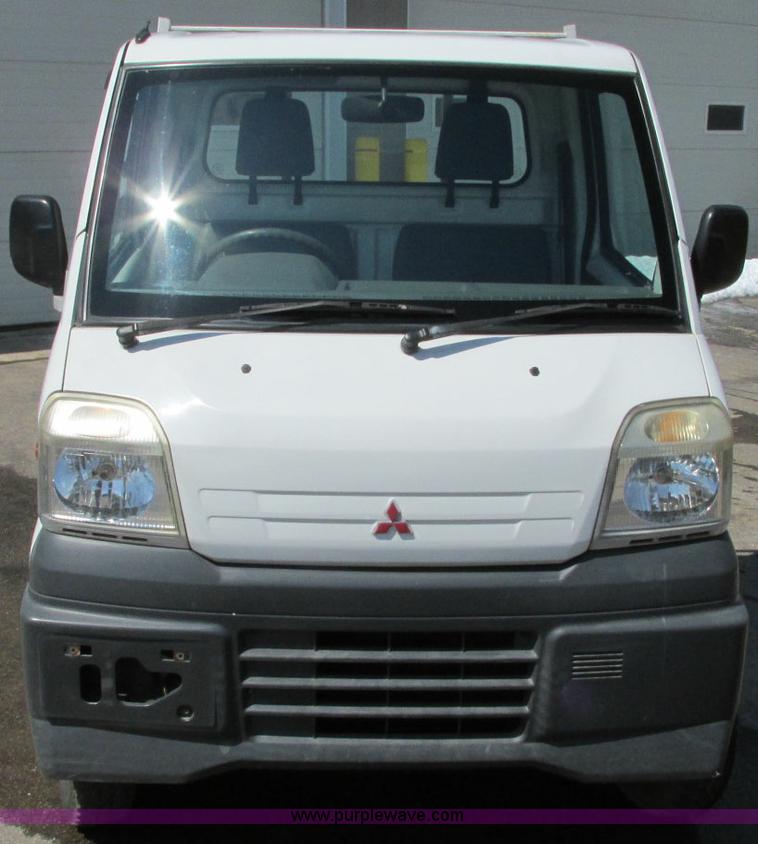 image for item E5072 1999 Mitsubishi minicab truck with dump bed