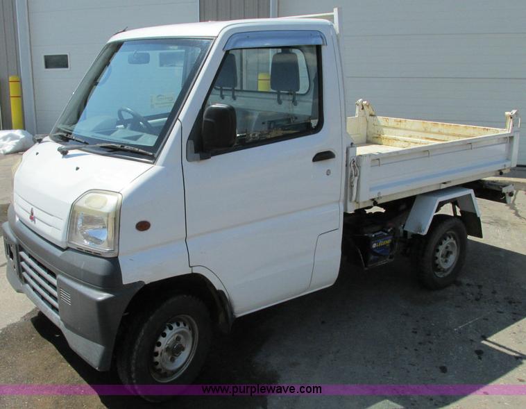 image for item E5072 1999 Mitsubishi minicab truck with dump bed