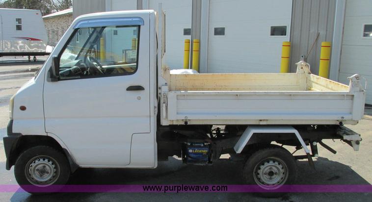 image for item E5072 1999 Mitsubishi minicab truck with dump bed