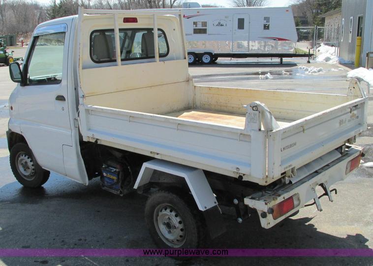 image for item E5072 1999 Mitsubishi minicab truck with dump bed