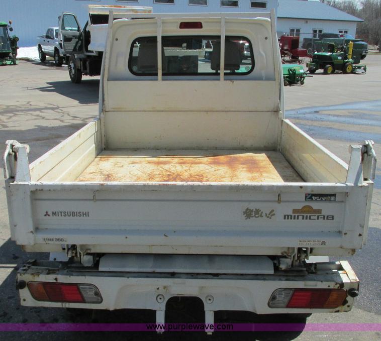 image for item E5072 1999 Mitsubishi minicab truck with dump bed