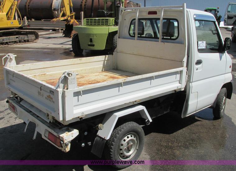 image for item E5072 1999 Mitsubishi minicab truck with dump bed