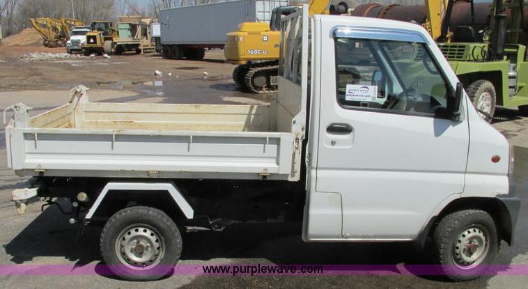 image for item E5072 1999 Mitsubishi minicab truck with dump bed