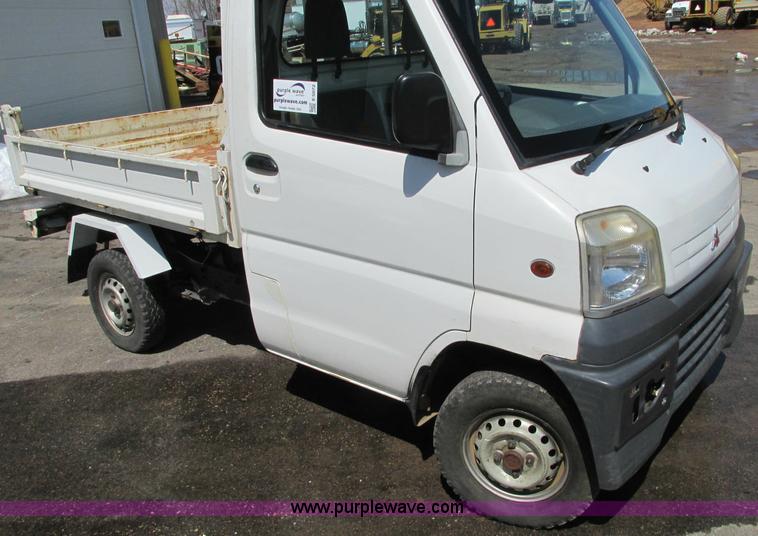 image for item E5072 1999 Mitsubishi minicab truck with dump bed