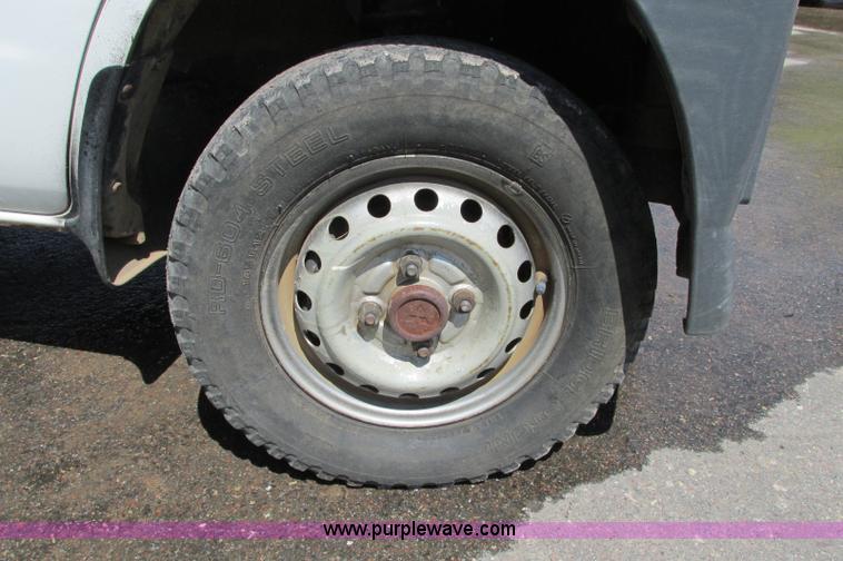 image for item E5072 1999 Mitsubishi minicab truck with dump bed