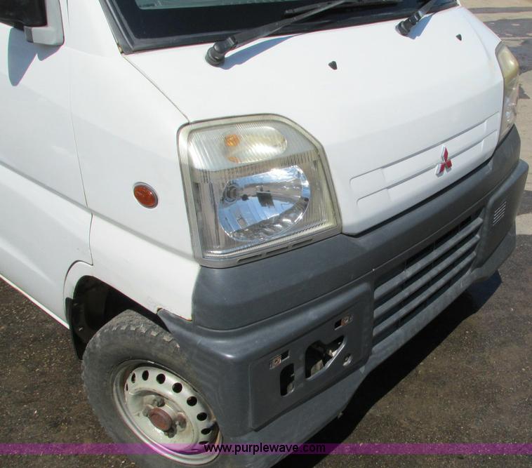 image for item E5072 1999 Mitsubishi minicab truck with dump bed