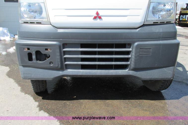 image for item E5072 1999 Mitsubishi minicab truck with dump bed