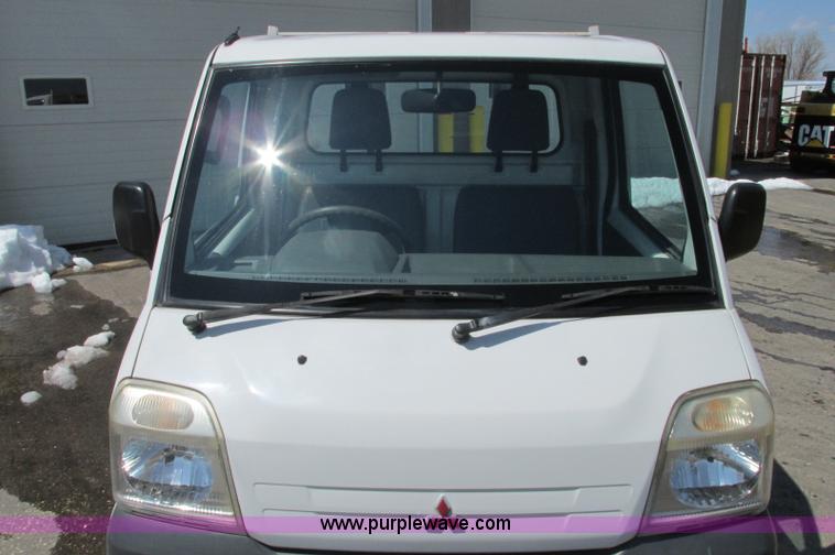 image for item E5072 1999 Mitsubishi minicab truck with dump bed
