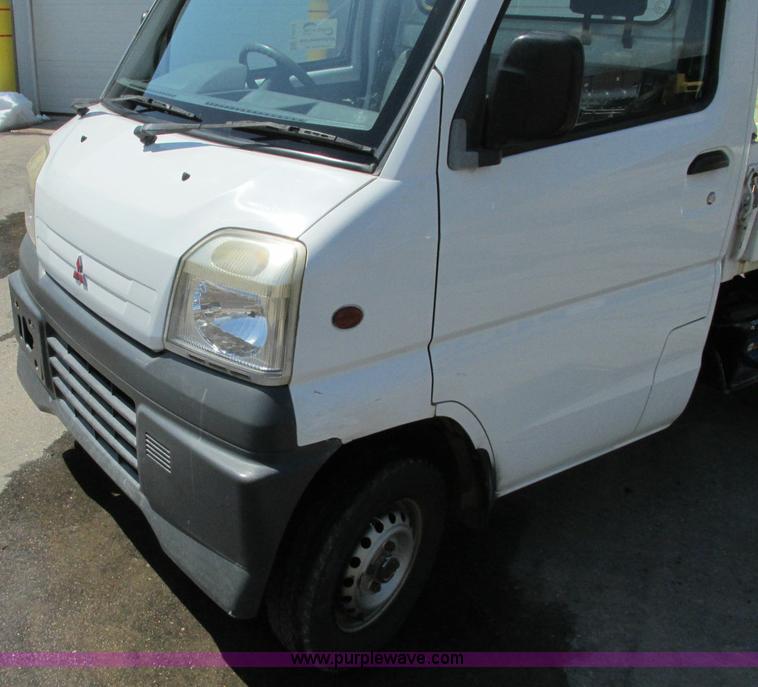 image for item E5072 1999 Mitsubishi minicab truck with dump bed