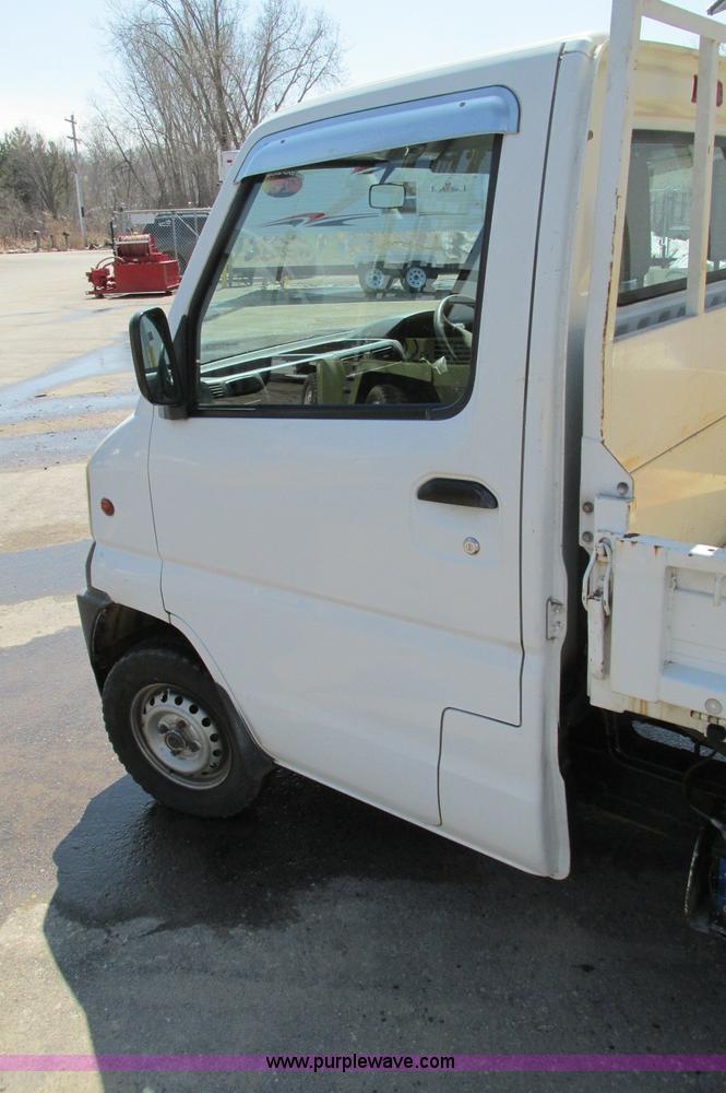 image for item E5072 1999 Mitsubishi minicab truck with dump bed