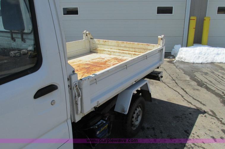 image for item E5072 1999 Mitsubishi minicab truck with dump bed