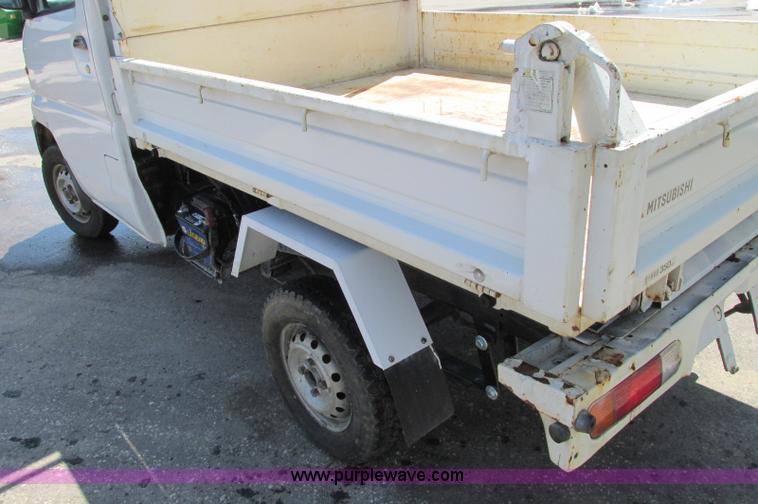 image for item E5072 1999 Mitsubishi minicab truck with dump bed