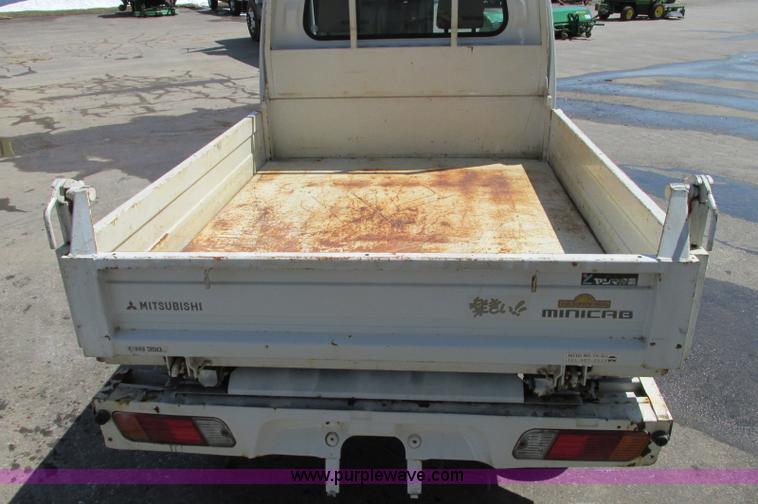 image for item E5072 1999 Mitsubishi minicab truck with dump bed