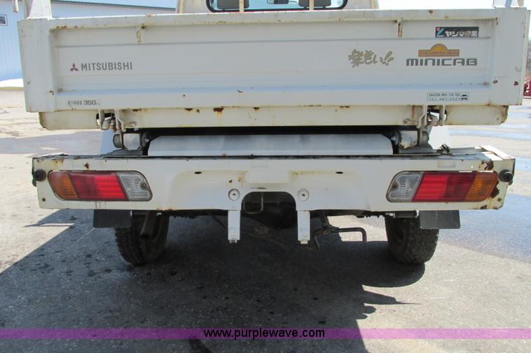 image for item E5072 1999 Mitsubishi minicab truck with dump bed