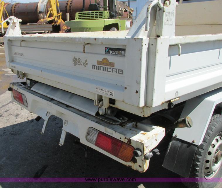 image for item E5072 1999 Mitsubishi minicab truck with dump bed