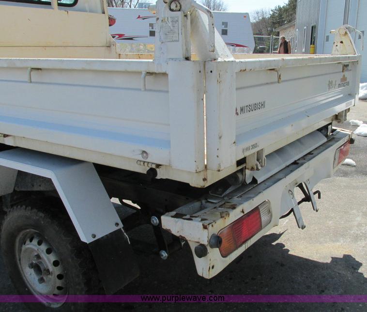 image for item E5072 1999 Mitsubishi minicab truck with dump bed