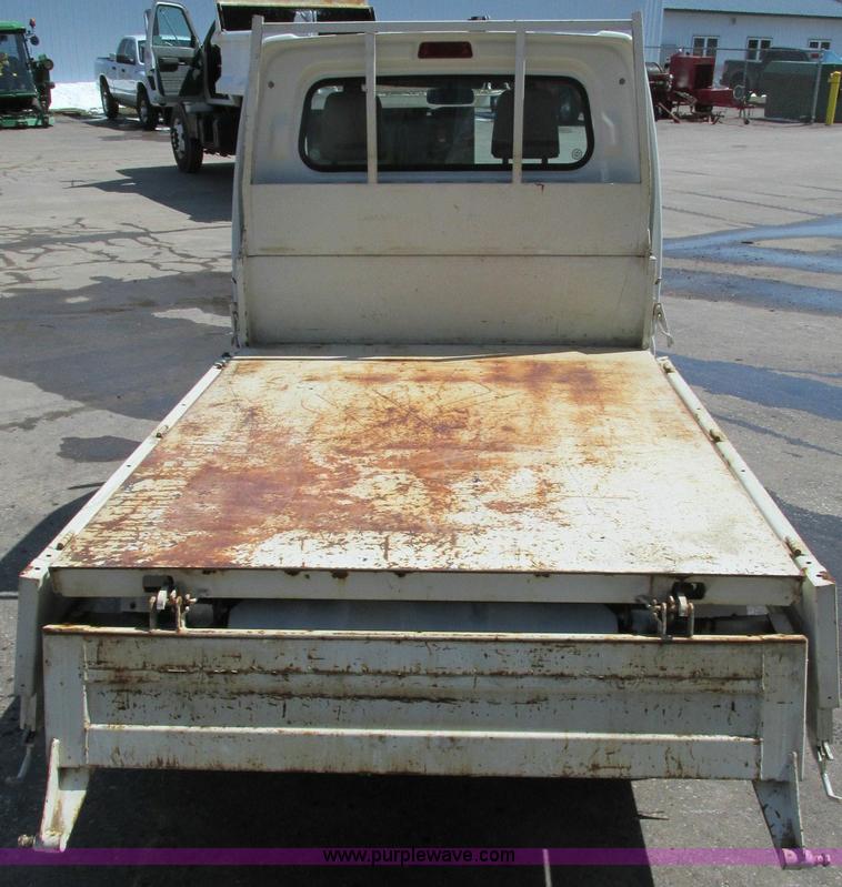 image for item E5072 1999 Mitsubishi minicab truck with dump bed