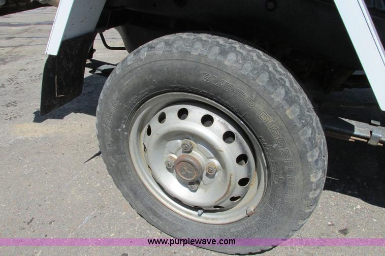 image for item E5072 1999 Mitsubishi minicab truck with dump bed