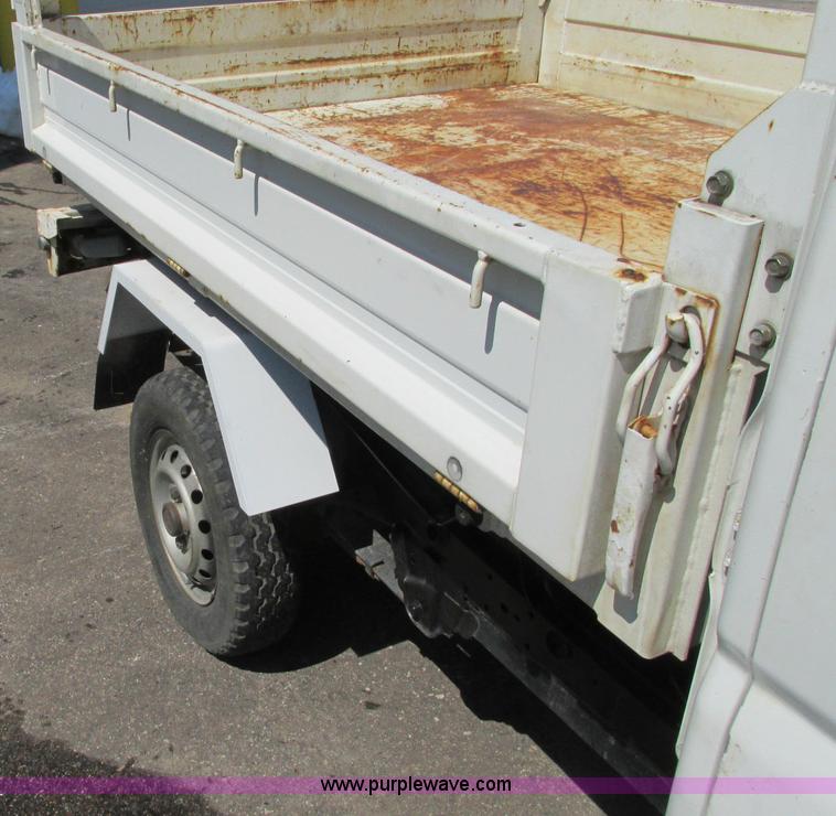 image for item E5072 1999 Mitsubishi minicab truck with dump bed