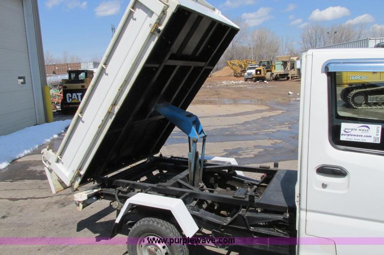 image for item E5072 1999 Mitsubishi minicab truck with dump bed