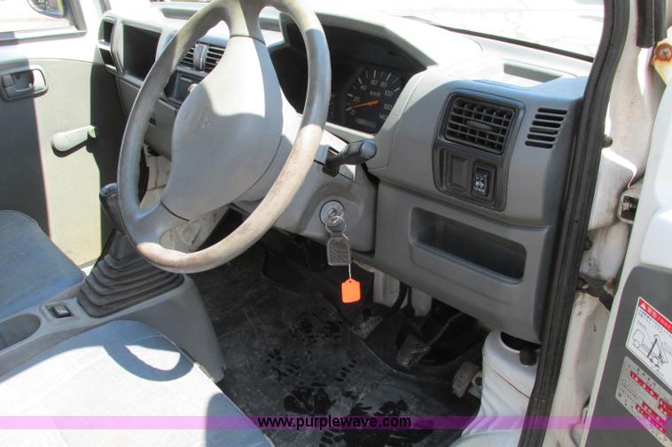 image for item E5072 1999 Mitsubishi minicab truck with dump bed